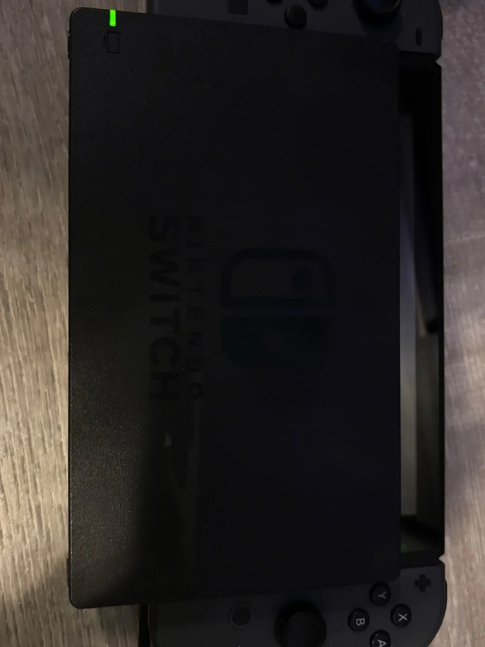 Nintendo Switch Console with Dark Gray Joy‑Con and Black Dock
